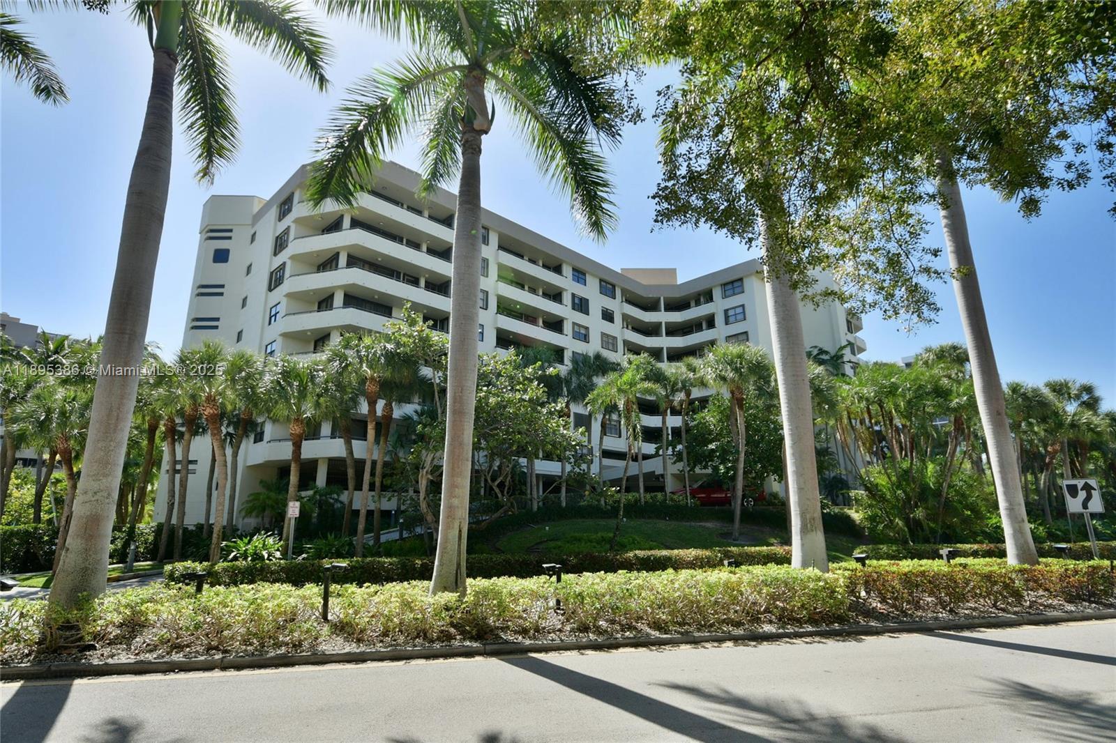 170 Ocean Ln Drive, Unit 311 Key Biscayne, FL 33149 - Photo 29 of 32 front view of a building with a tree