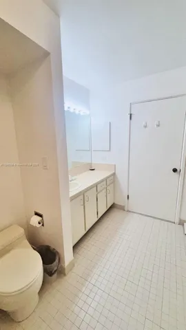a bathroom with a sink toilet and vanity