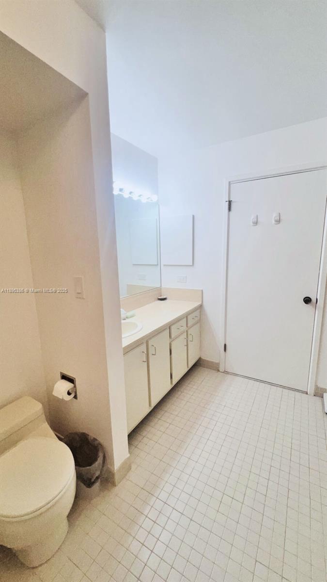 170 Ocean Ln Drive, Unit 311 Key Biscayne, FL 33149 - Photo 5 of 32 a bathroom with a sink toilet and vanity