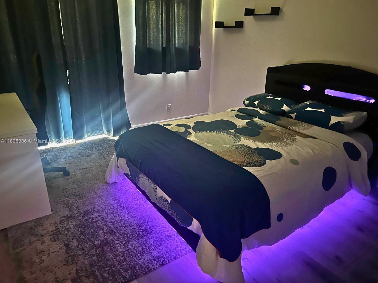 170 Ocean Ln Drive, Unit 311 Key Biscayne, FL 33149 - Photo 7 of 32 a bedroom with a bed and a small yard