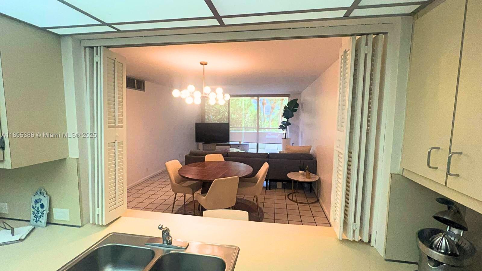 170 Ocean Ln Drive, Unit 311 Key Biscayne, FL 33149 - Photo 10 of 32 a living room with furniture and a window