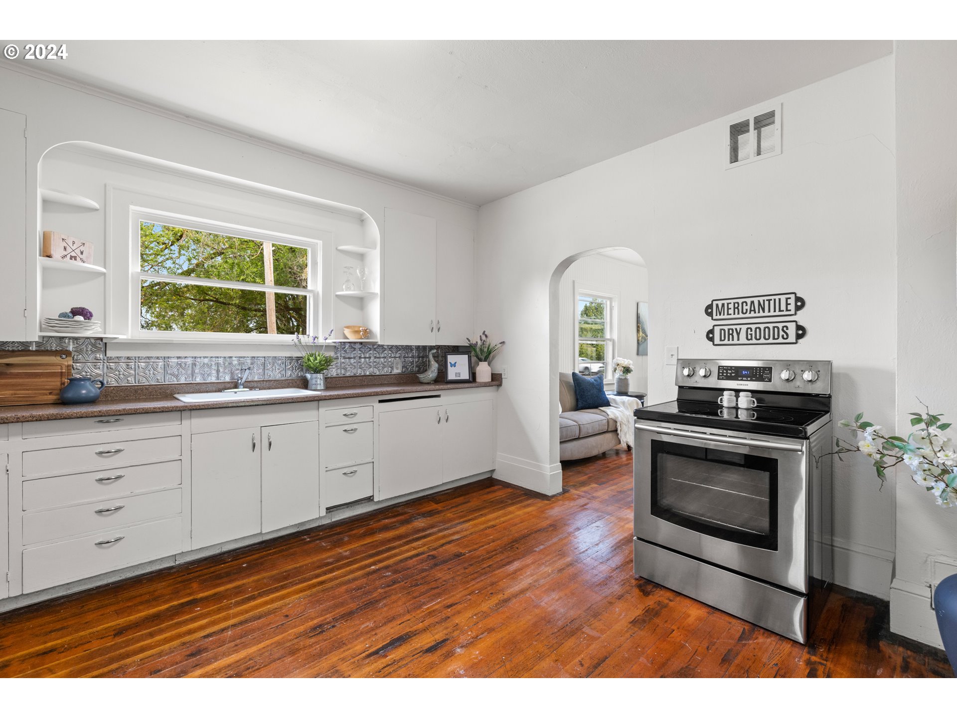 31262 Southeast Kelso Road Boring, OR 97009 - Photo 20 of 48 a kitchen with stainless steel appliances granite countertop a stove a sink and a microwave