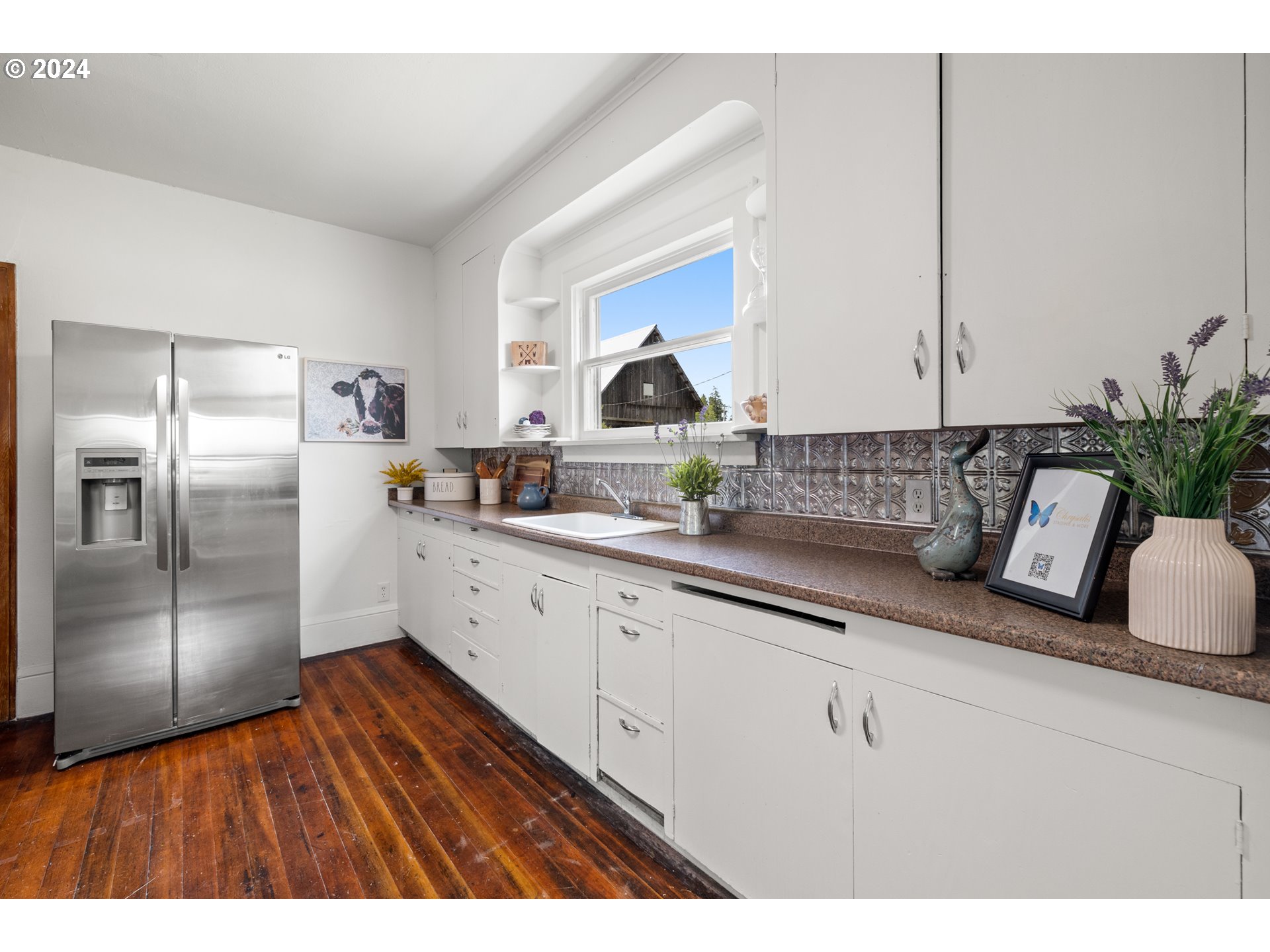 31262 Southeast Kelso Road Boring, OR 97009 - Photo 22 of 48 a kitchen with granite countertop a refrigerator and a sink