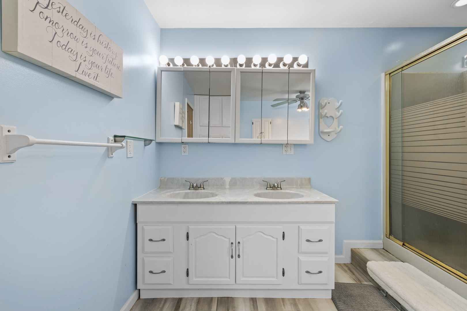 4 Saugatuck Road Montgomery, IL 60538 - Photo 14 of 24 a bathroom with a sink vanity and mirror