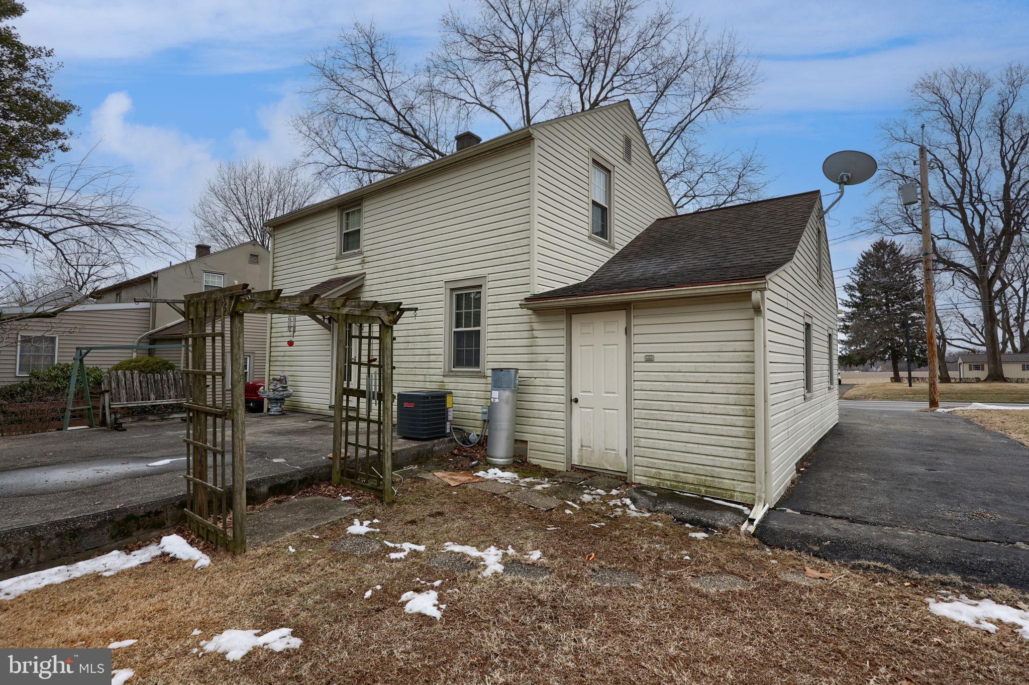 1297 Graystone Road Manheim, PA 17545 - Photo 24 of 29 a view of a house with a yard and garage