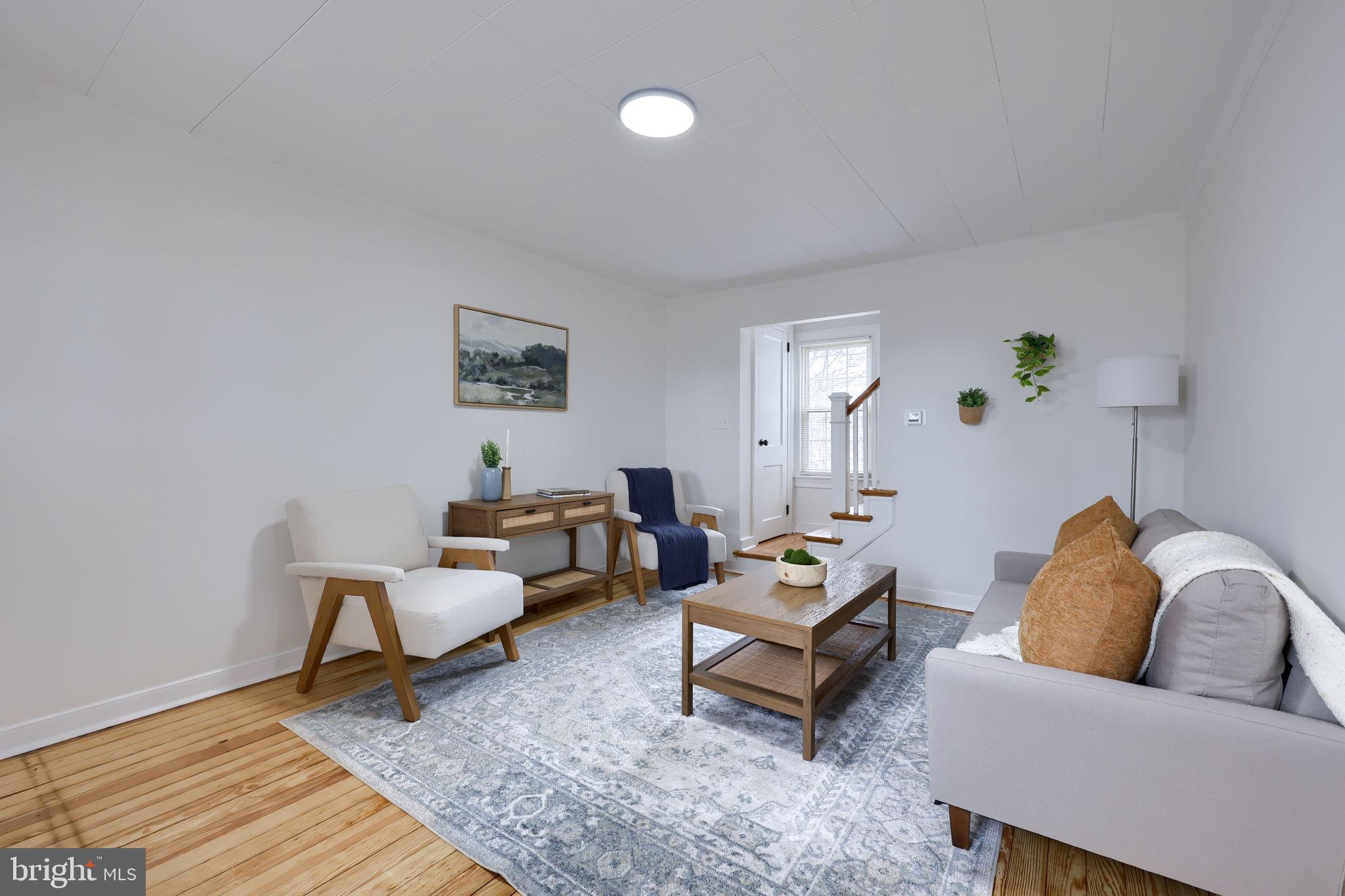 1297 Graystone Road Manheim, PA 17545 - Photo 6 of 29 a living room with furniture and wooden floor