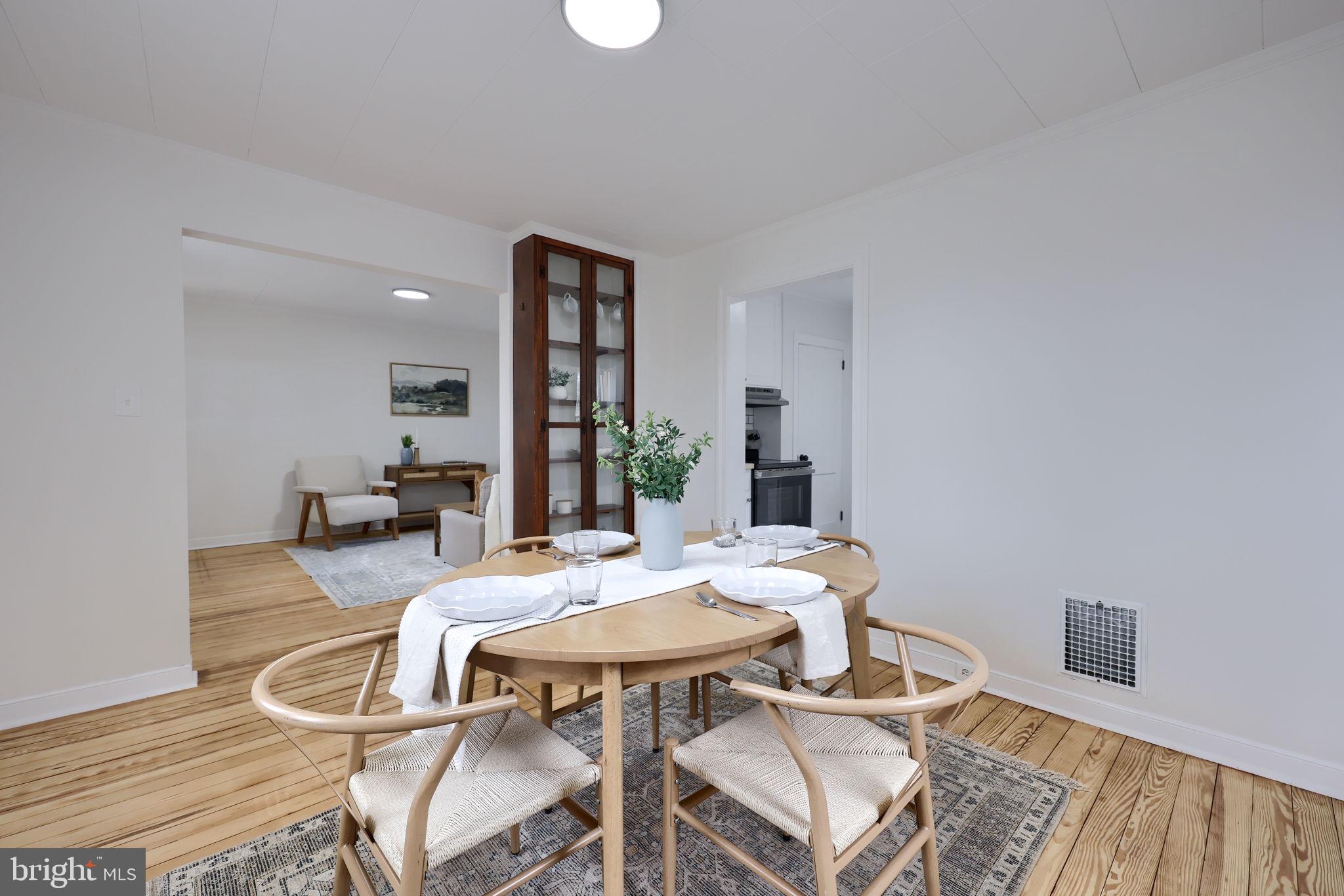 1297 Graystone Road Manheim, PA 17545 - Photo 7 of 29 a view of a dining room with furniture and wooden floor