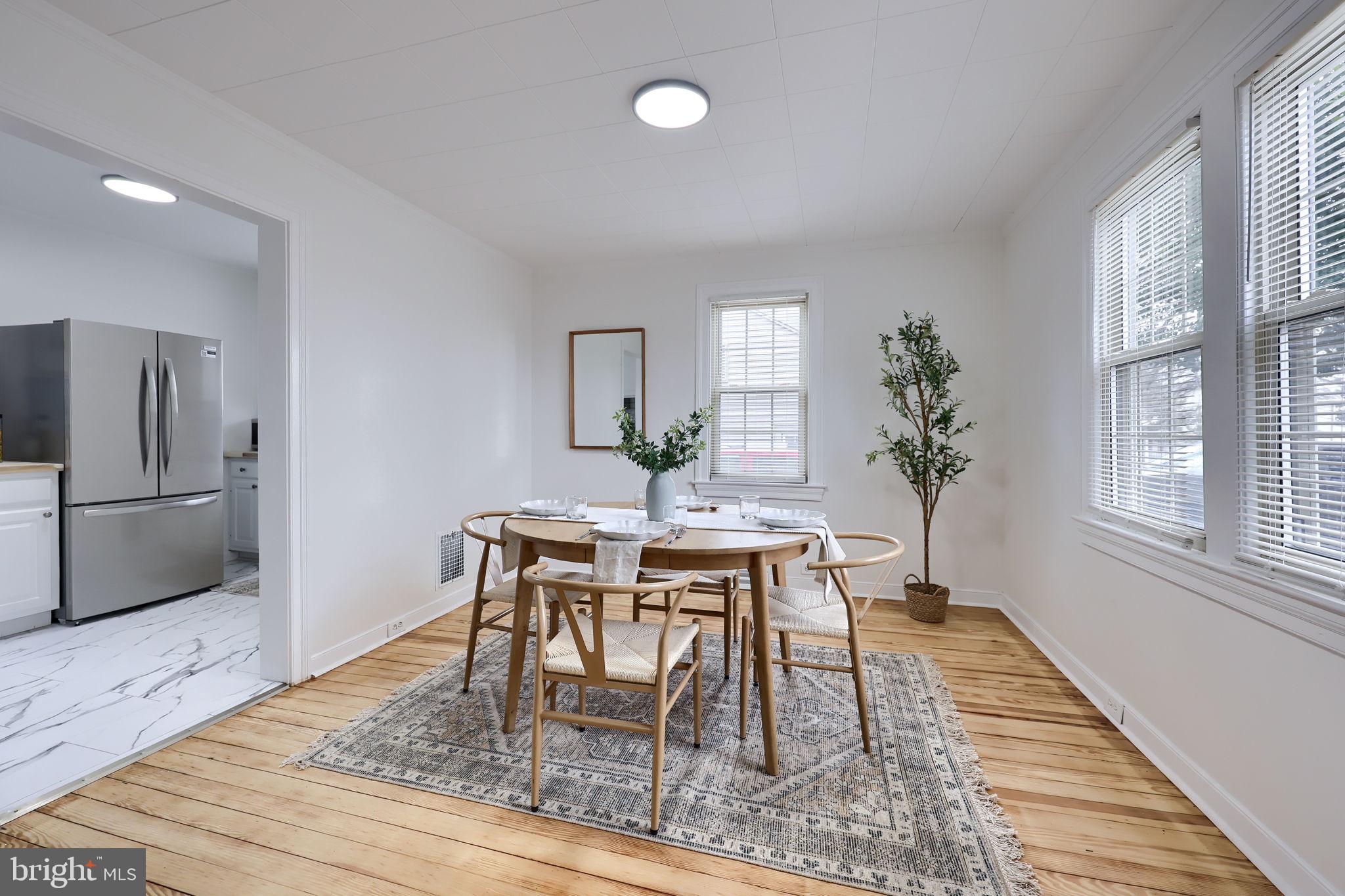 1297 Graystone Road Manheim, PA 17545 - Photo 9 of 29 a view of a dining room with furniture window and wooden floor