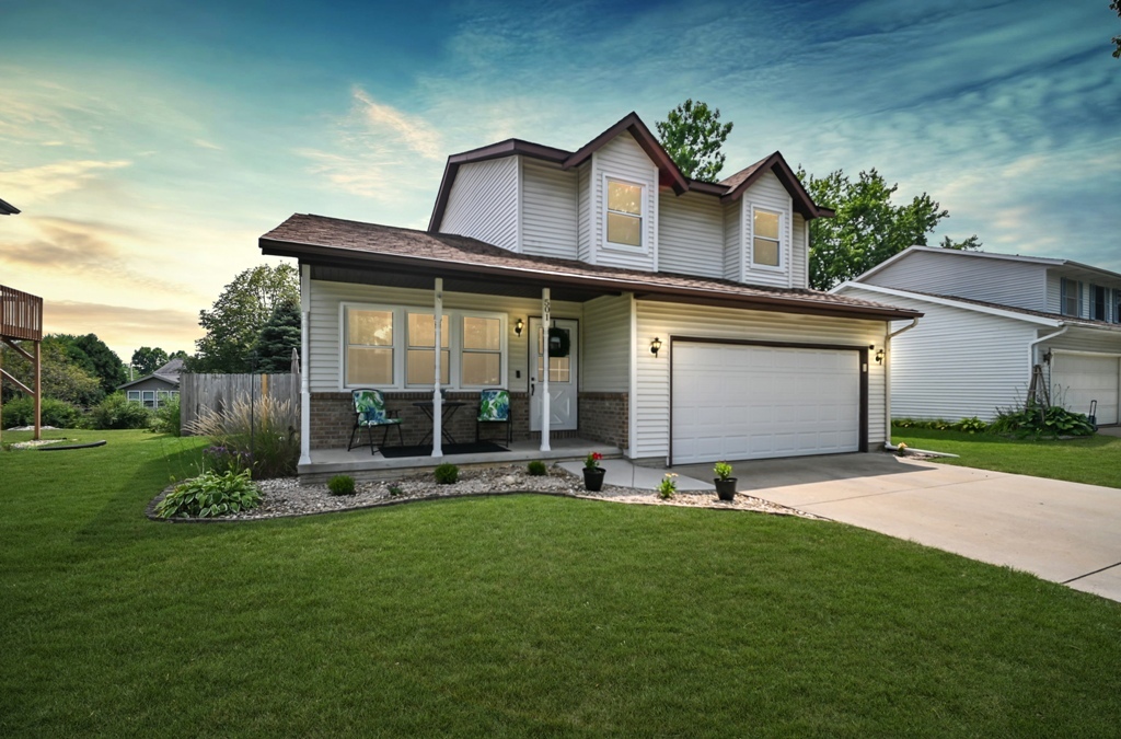 501 Carriage Hills Road Normal, IL 61761 - Photo 2 of 77 a view of a house with a yard and sitting area