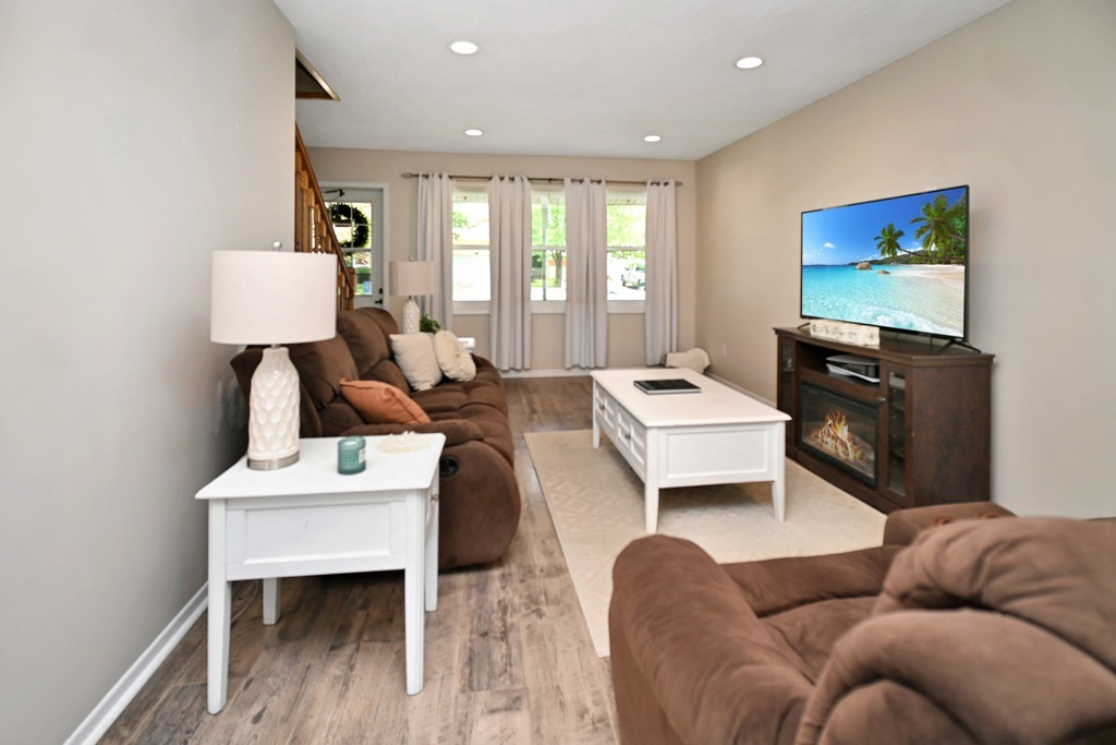 501 Carriage Hills Road Normal, IL 61761 - Photo 24 of 77 a living room with furniture and a flat screen tv