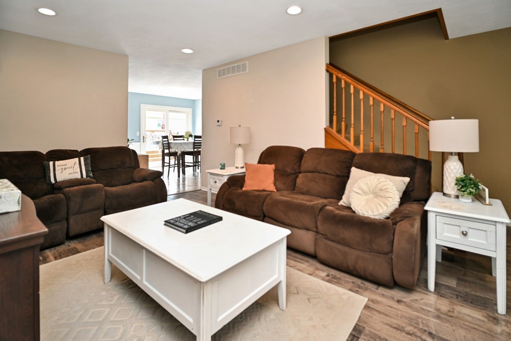501 Carriage Hills Road Normal, IL 61761 - Photo 25 of 77 a living room with furniture and a wooden floor