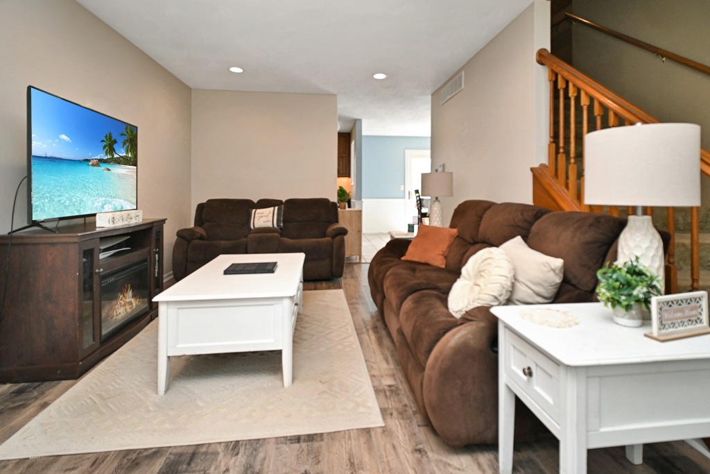 501 Carriage Hills Road Normal, IL 61761 - Photo 27 of 77 a living room with furniture and a flat screen tv