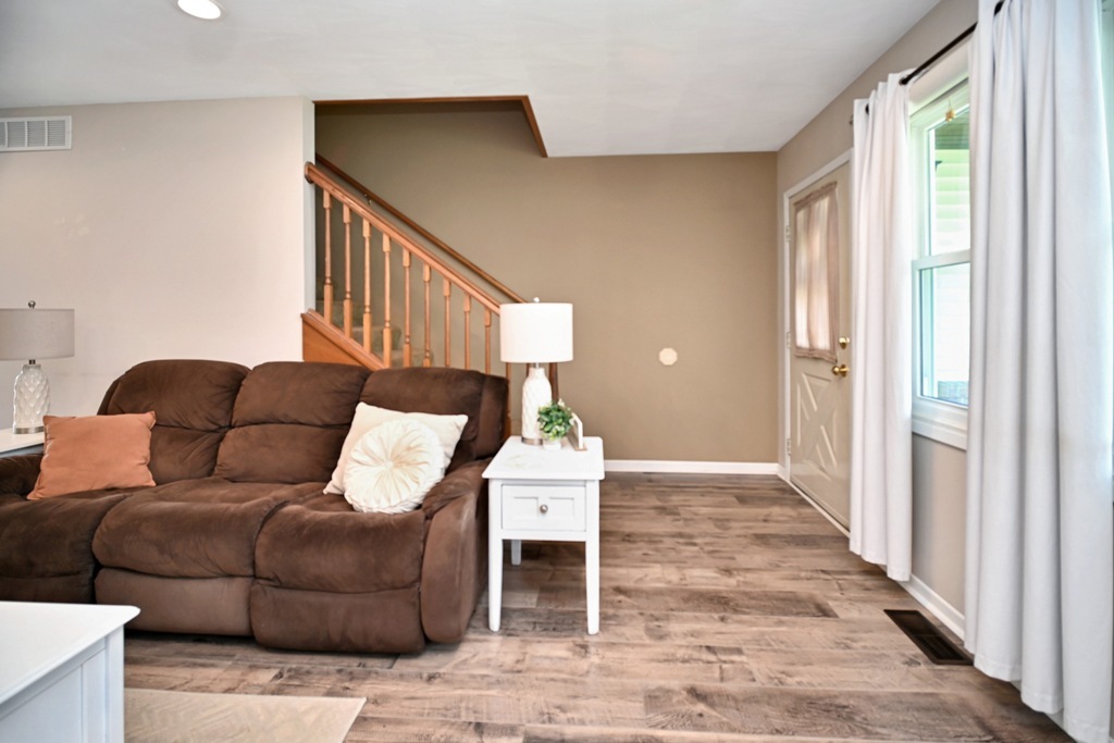 501 Carriage Hills Road Normal, IL 61761 - Photo 28 of 77 a living room with furniture and a window