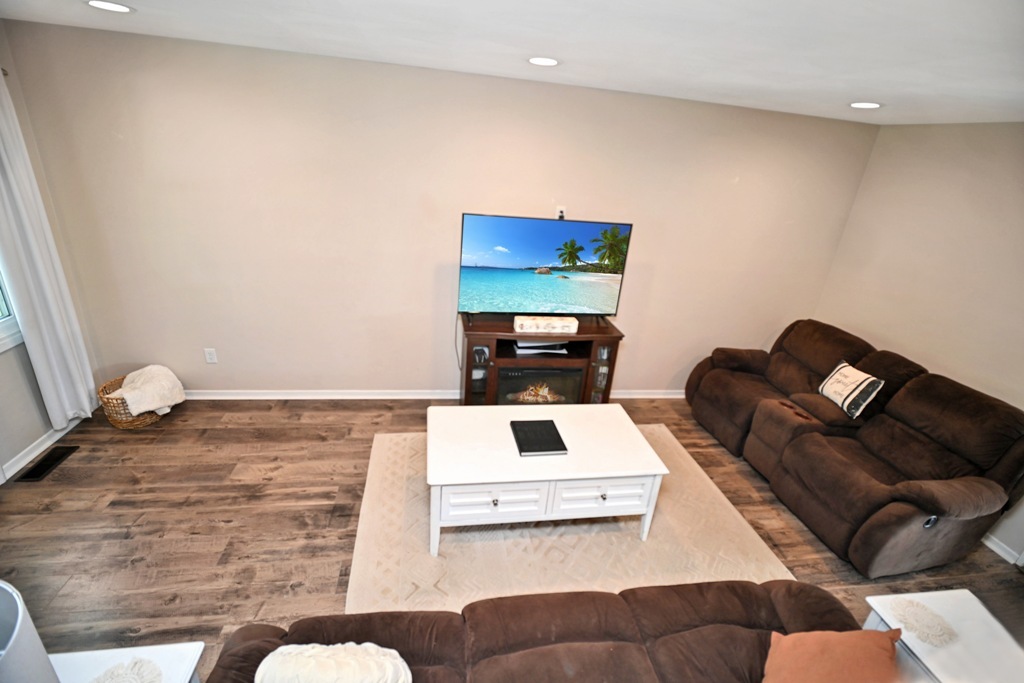 501 Carriage Hills Road Normal, IL 61761 - Photo 30 of 77 a living room with furniture and a flat screen tv