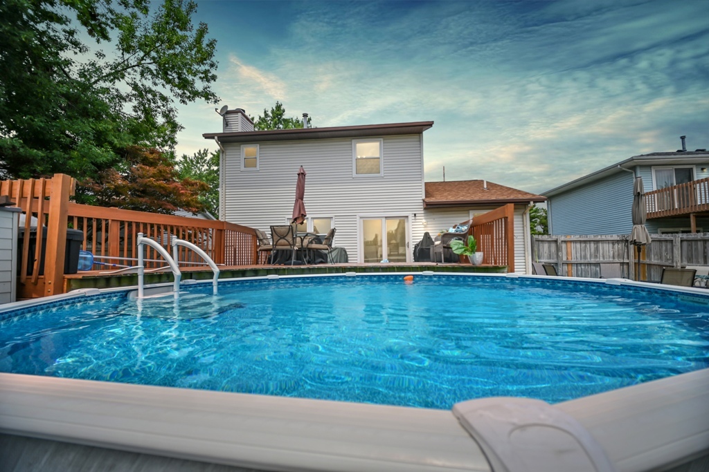 501 Carriage Hills Road Normal, IL 61761 - Photo 3 of 77 a view of a backyard with table and chairs and wooden floor