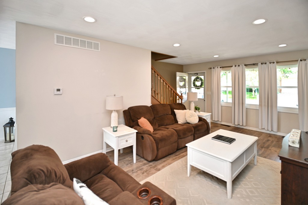 501 Carriage Hills Road Normal, IL 61761 - Photo 31 of 77 a living room with furniture and large windows