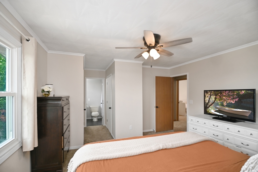 501 Carriage Hills Road Normal, IL 61761 - Photo 36 of 77 a bedroom with a bed and a flat screen tv