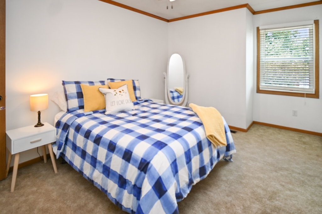 501 Carriage Hills Road Normal, IL 61761 - Photo 42 of 77 a bedroom with bed and window