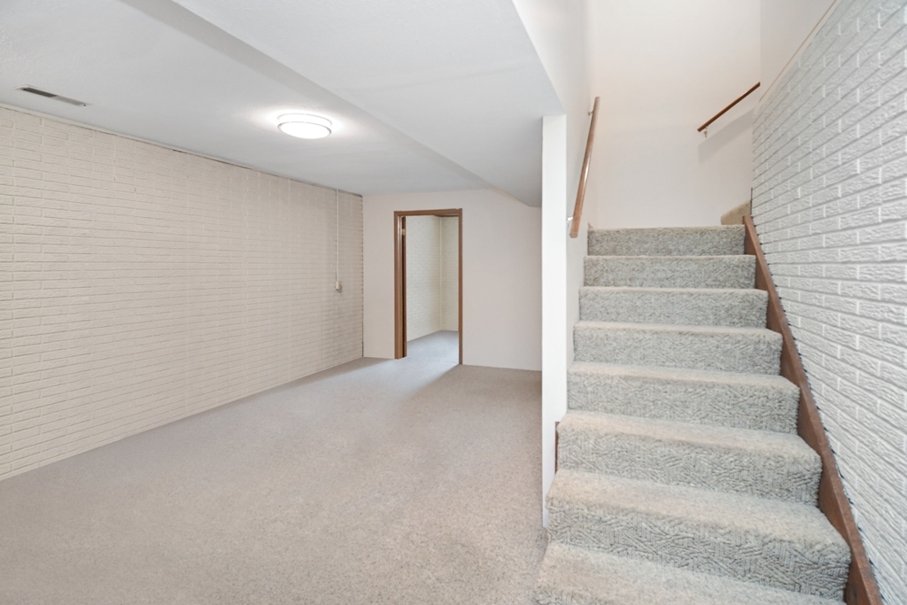 501 Carriage Hills Road Normal, IL 61761 - Photo 51 of 77 a view of an empty room with stairs