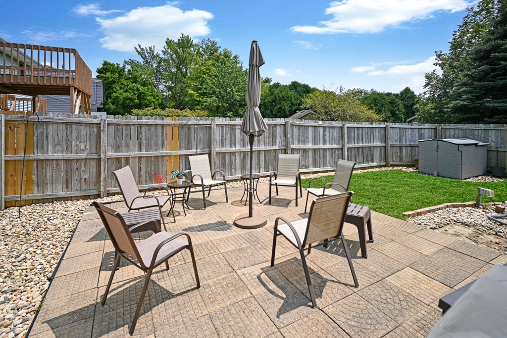 501 Carriage Hills Road Normal, IL 61761 - Photo 66 of 77 a view of a chairs and table in the patio