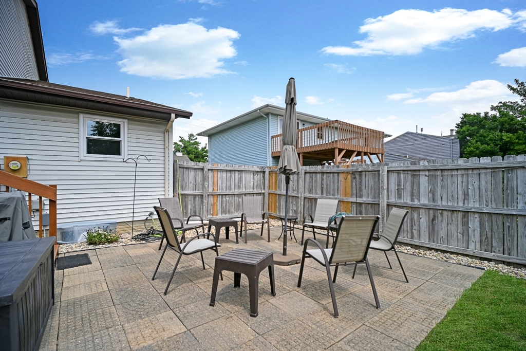 501 Carriage Hills Road Normal, IL 61761 - Photo 68 of 77 a patio with table and chairs