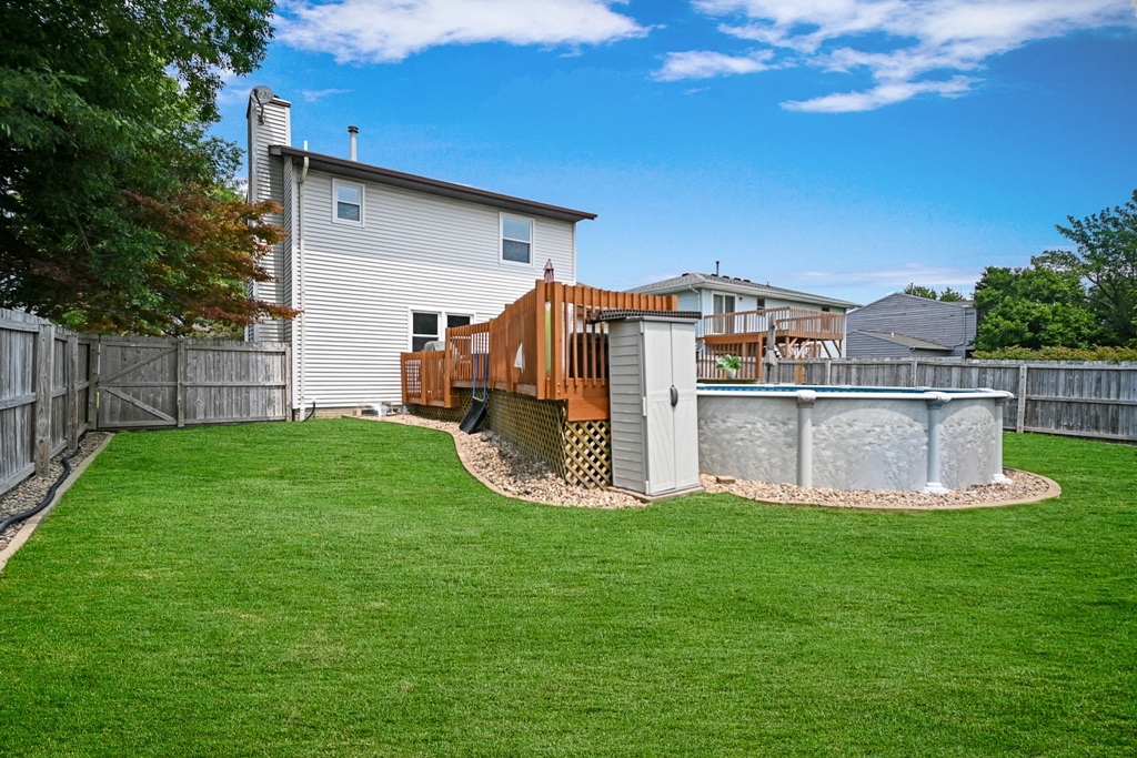 501 Carriage Hills Road Normal, IL 61761 - Photo 70 of 77 a view of a house with a big yard and large trees