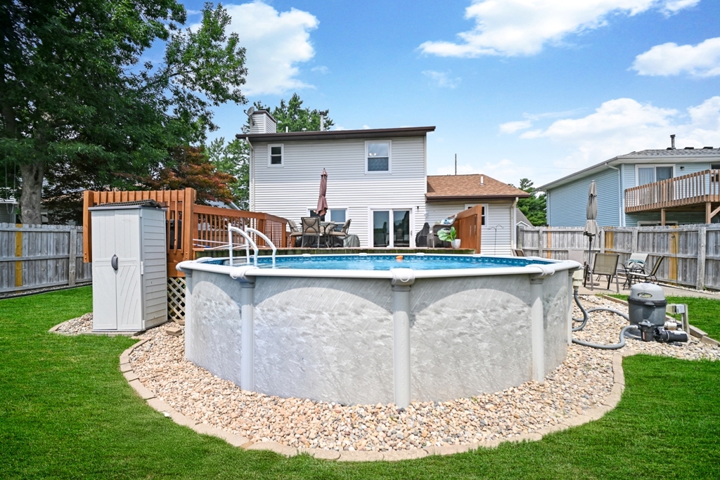 501 Carriage Hills Road Normal, IL 61761 - Photo 71 of 77 a view of a house with a big yard and sitting area