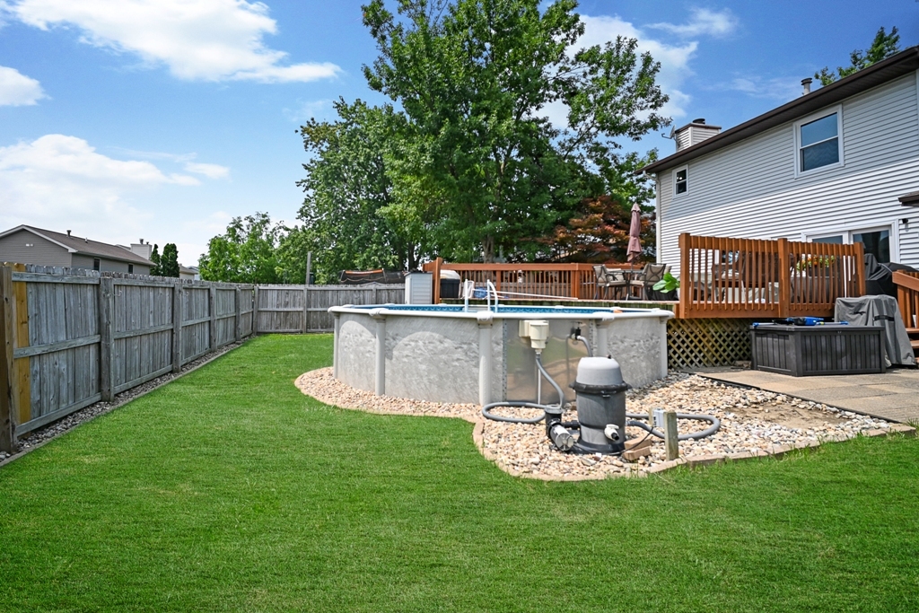 501 Carriage Hills Road Normal, IL 61761 - Photo 72 of 77 a white house with a big yard and wooden fence