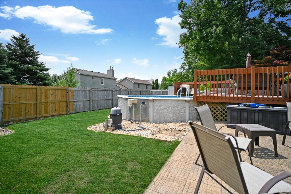 501 Carriage Hills Road Normal, IL 61761 - Photo 74 of 77 a view of a chairs and table on the wooden deck