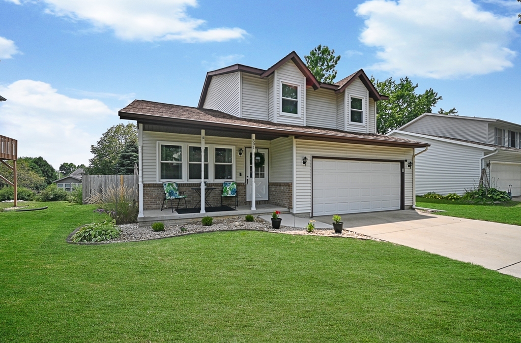 501 Carriage Hills Road Normal, IL 61761 - Photo 75 of 77 a view of a house with a yard and sitting area