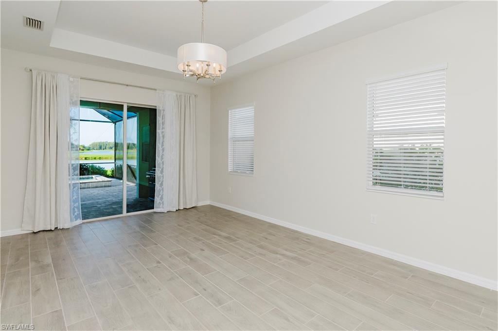 5423 Ternberry Road Ave Maria, FL 34142 - Photo 11 of 50 a view of an empty room with a window