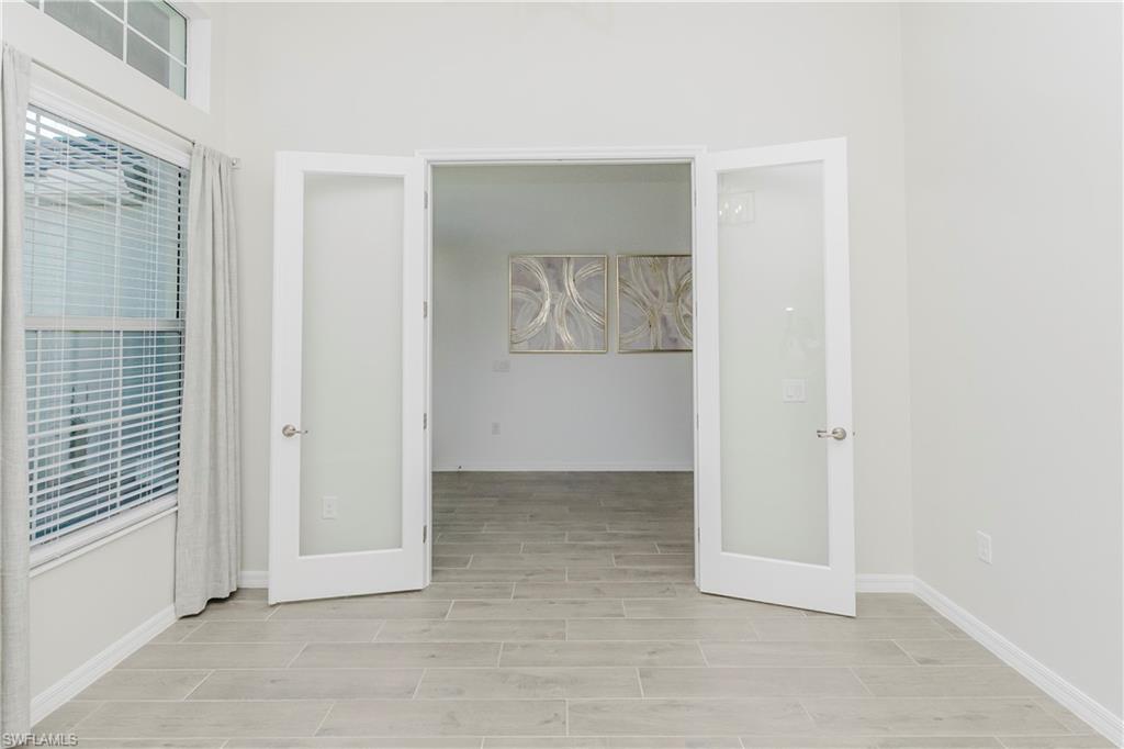 5423 Ternberry Road Ave Maria, FL 34142 - Photo 5 of 50 an empty room with windows and closet