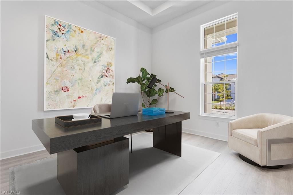 15564 Montello Lane Naples, FL 34114 - Photo 18 of 49 a living room with furniture and a potted plant
