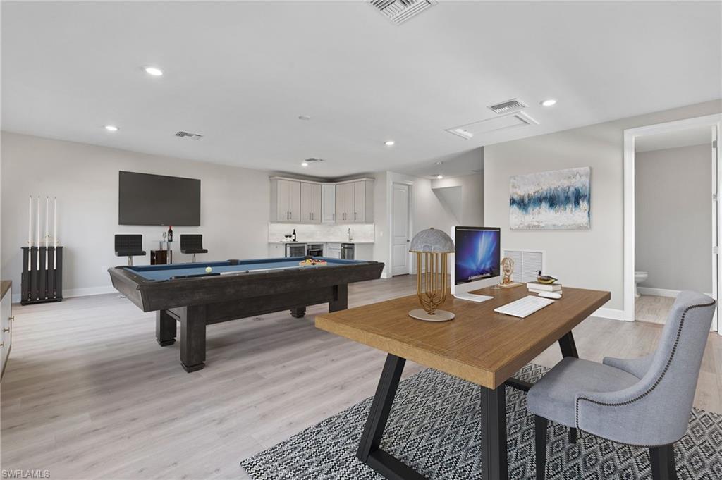 15564 Montello Lane Naples, FL 34114 - Photo 24 of 49 a room with furniture and a table