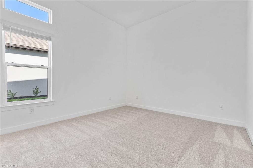 15564 Montello Lane Naples, FL 34114 - Photo 33 of 49 an empty room with a window