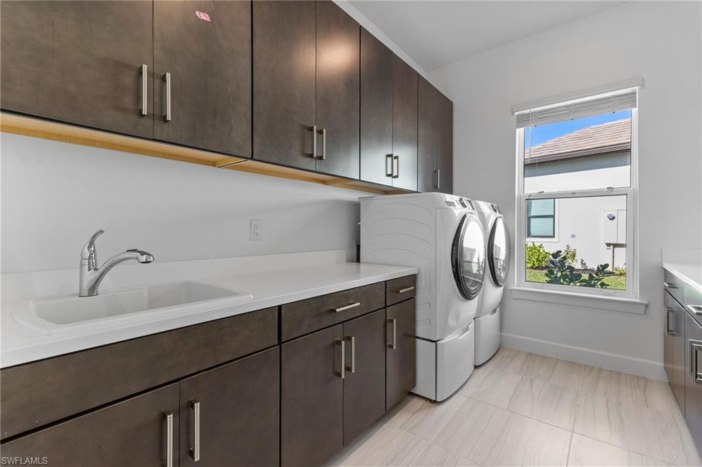 15564 Montello Lane Naples, FL 34114 - Photo 41 of 49 a kitchen with a sink and a window