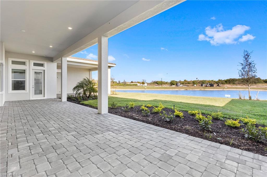 15564 Montello Lane Naples, FL 34114 - Photo 44 of 49 a view of a room with a garden and lake view