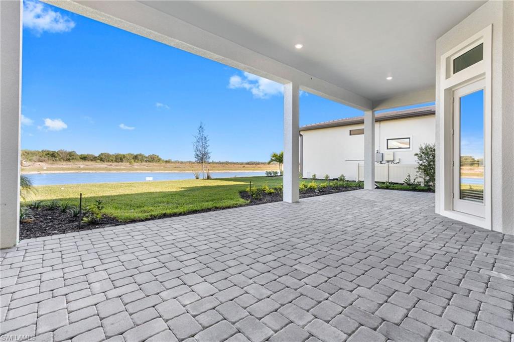 15564 Montello Lane Naples, FL 34114 - Photo 46 of 49 a view of a house with a yard and potted plants