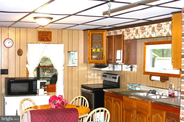 a kitchen with stainless steel appliances granite countertop a stove and a refrigerator