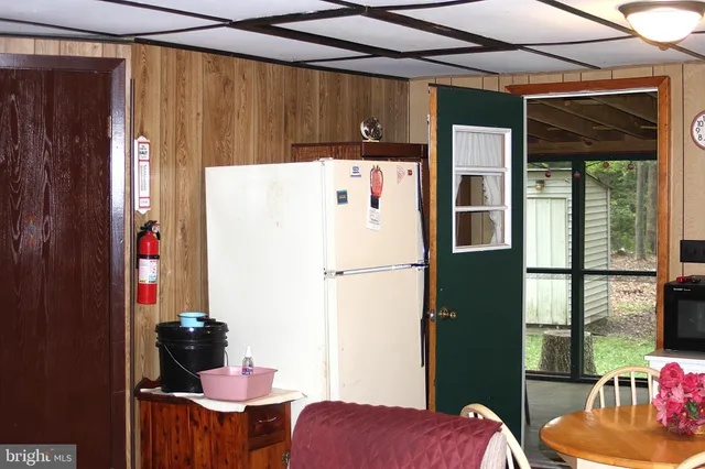 a white refrigerator freezer sitting inside of a kitchen