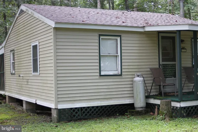a view of a house with a yard and an outdoor space