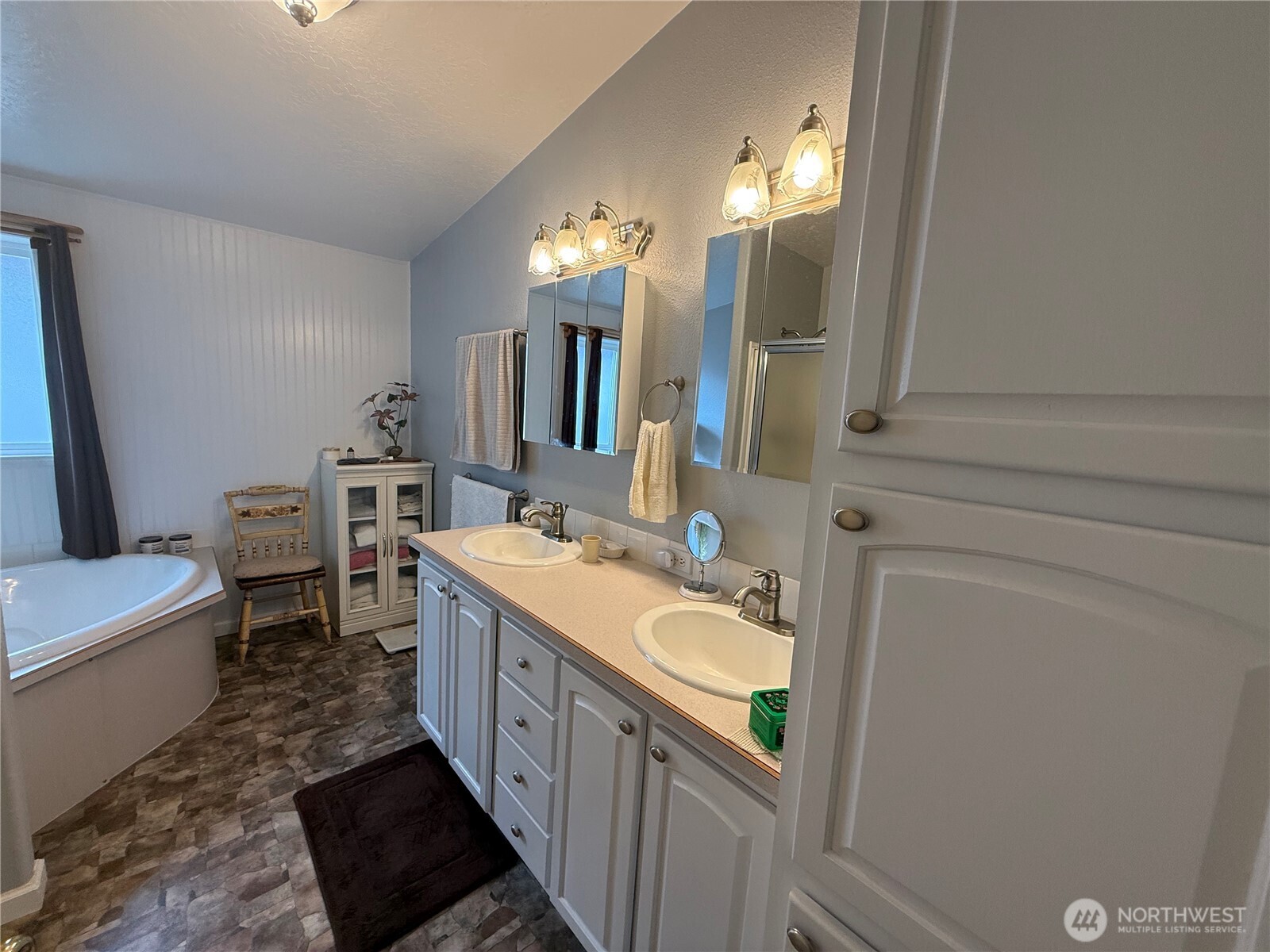 1934 Tucannon Road Pomeroy, WA 99347 - Photo 14 of 40 a bathroom with a double vanity sink and a mirror