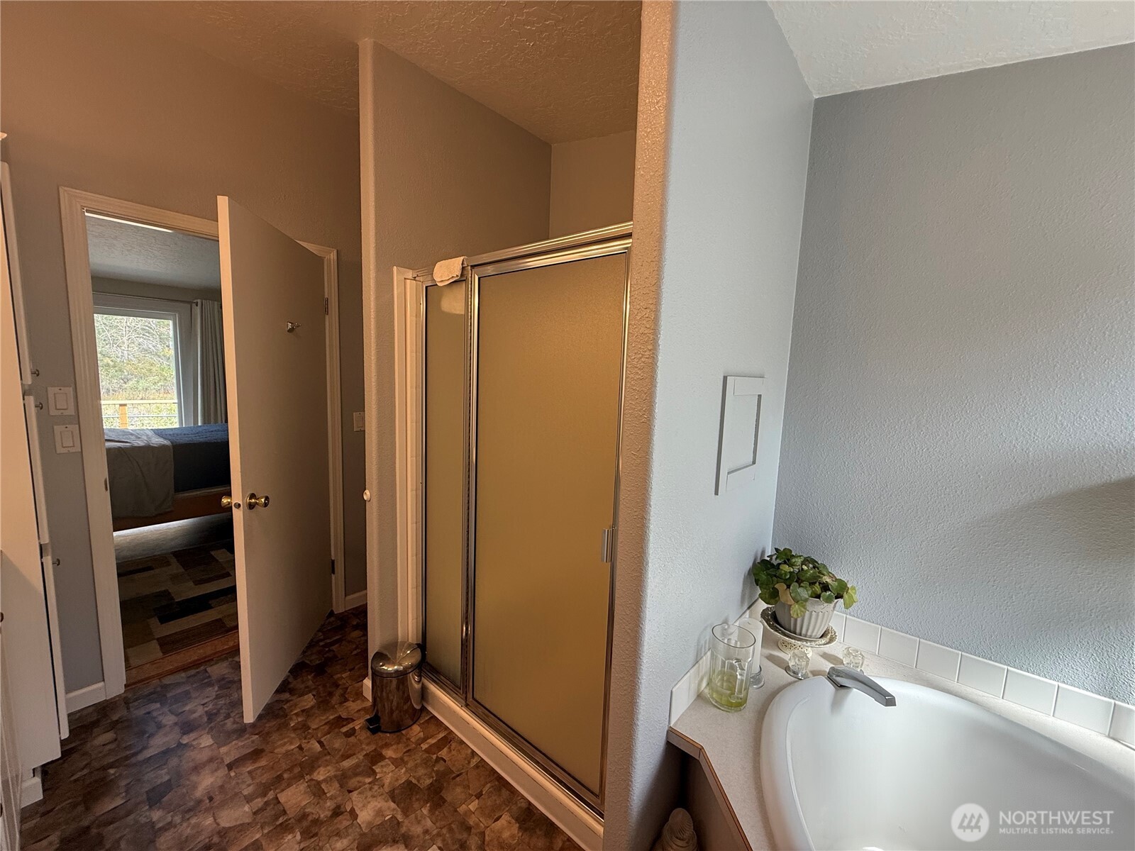 1934 Tucannon Road Pomeroy, WA 99347 - Photo 15 of 40 a bathroom with a tub shower and a sink