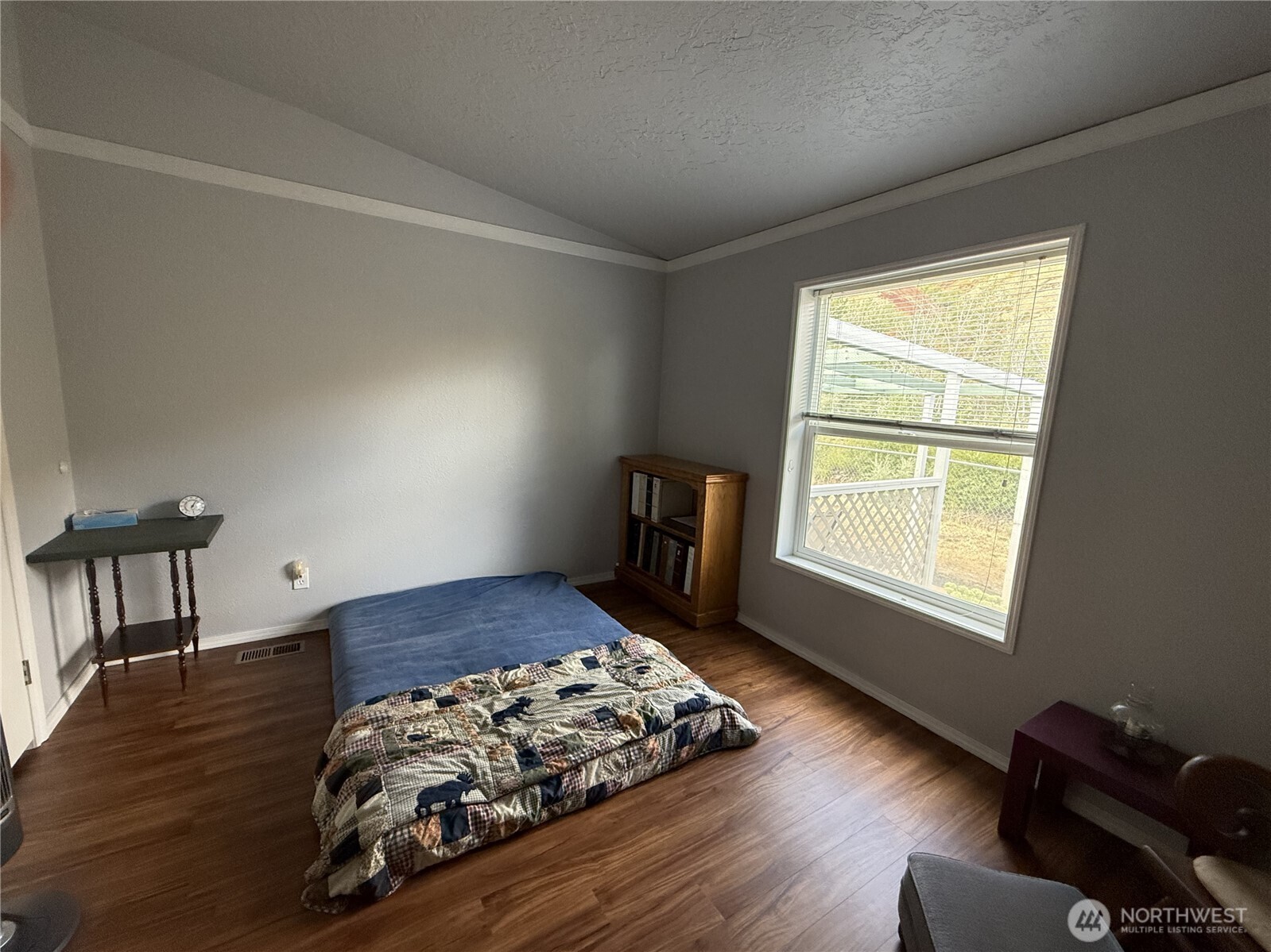 1934 Tucannon Road Pomeroy, WA 99347 - Photo 20 of 40 a bed sitting in a bedroom next to a window