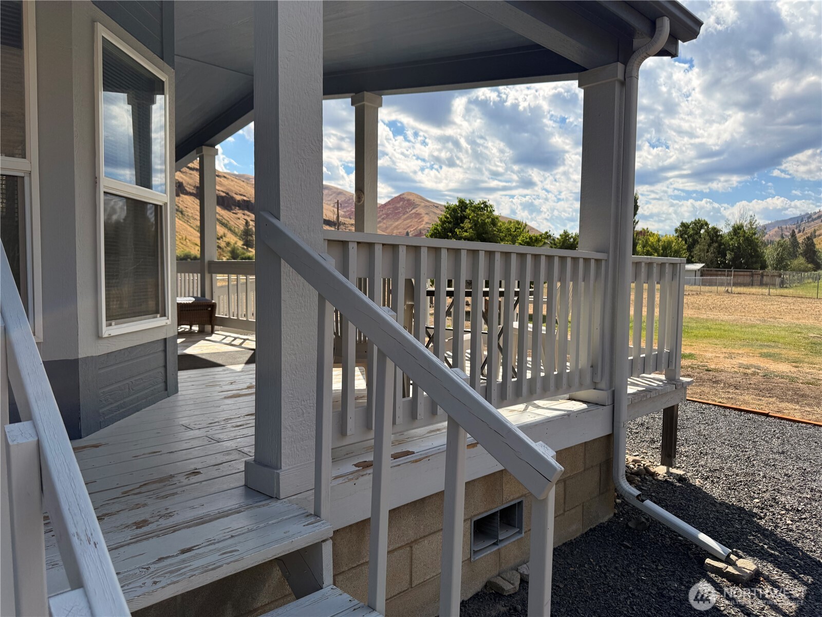 1934 Tucannon Road Pomeroy, WA 99347 - Photo 27 of 40 a view of balcony with wooden floor and outdoor seating