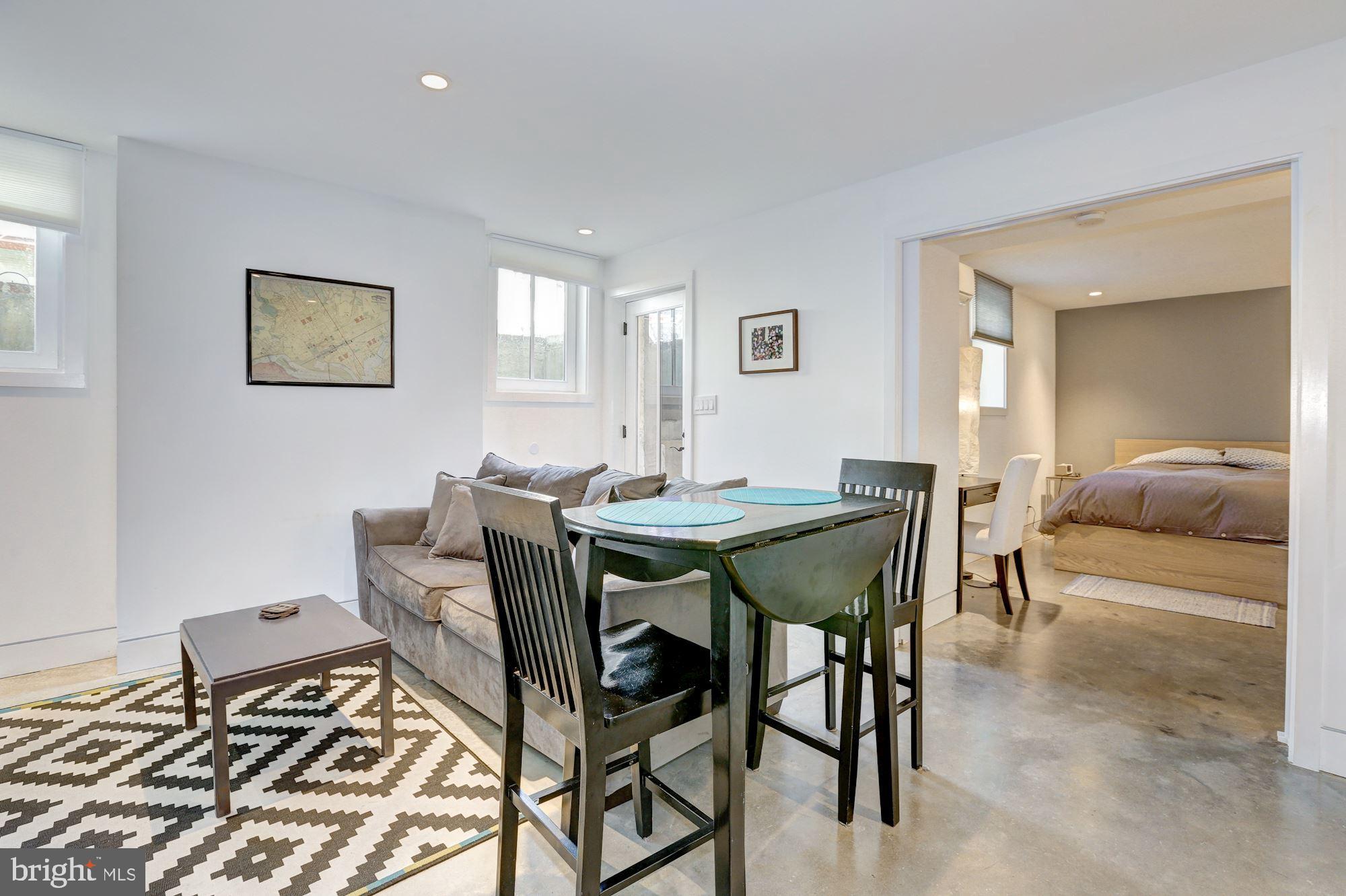 400 U Street Northwest, Unit LL Washington, DC 20001 - Photo 4 of 10 a view of a dining room with furniture and a rug