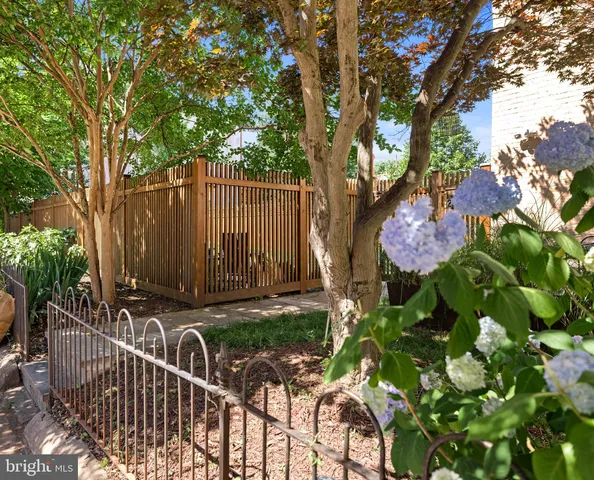 a view of a house with a tree in the background
