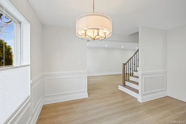a view of entryway with wooden floor