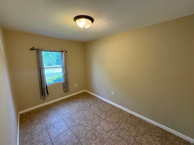 an empty room with closet area