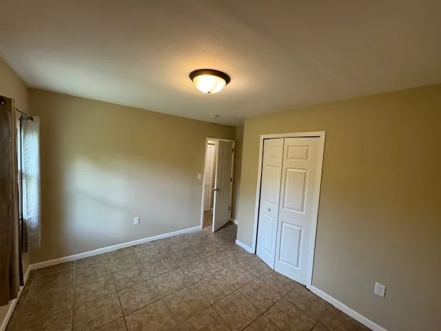 an empty room with a empty space and a window